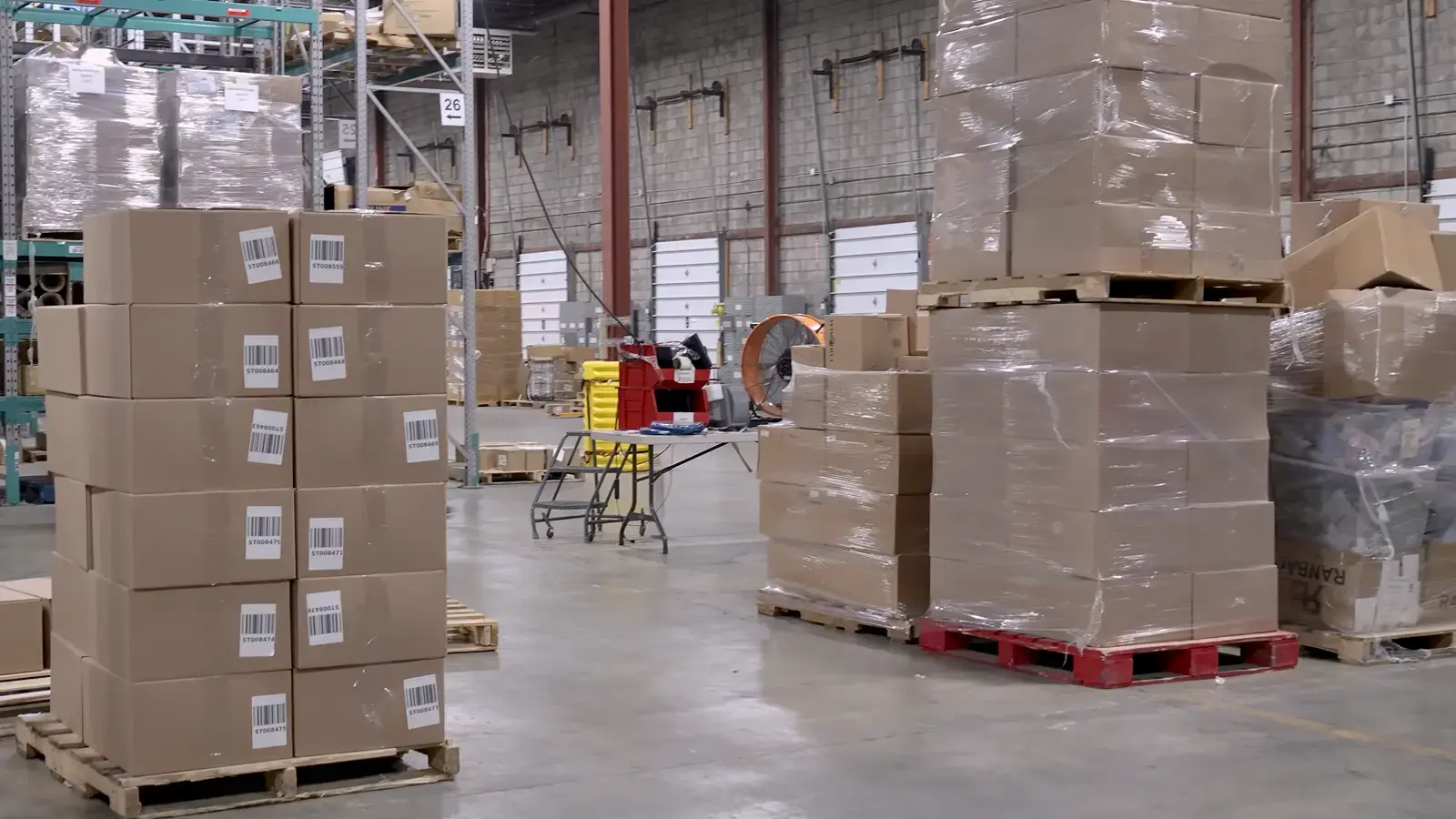 Protein powder and shaker kitted into a subscription bundle at an amz prep warehouse